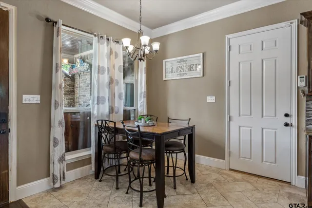 a bathroom with a granite countertop sink a toilet and a mirror