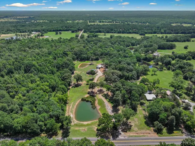 a living room with patio furniture and a fireplace