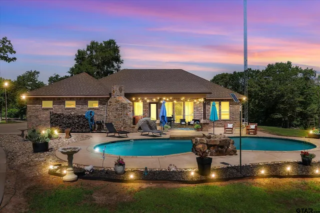 a swimming pool with outdoor seating