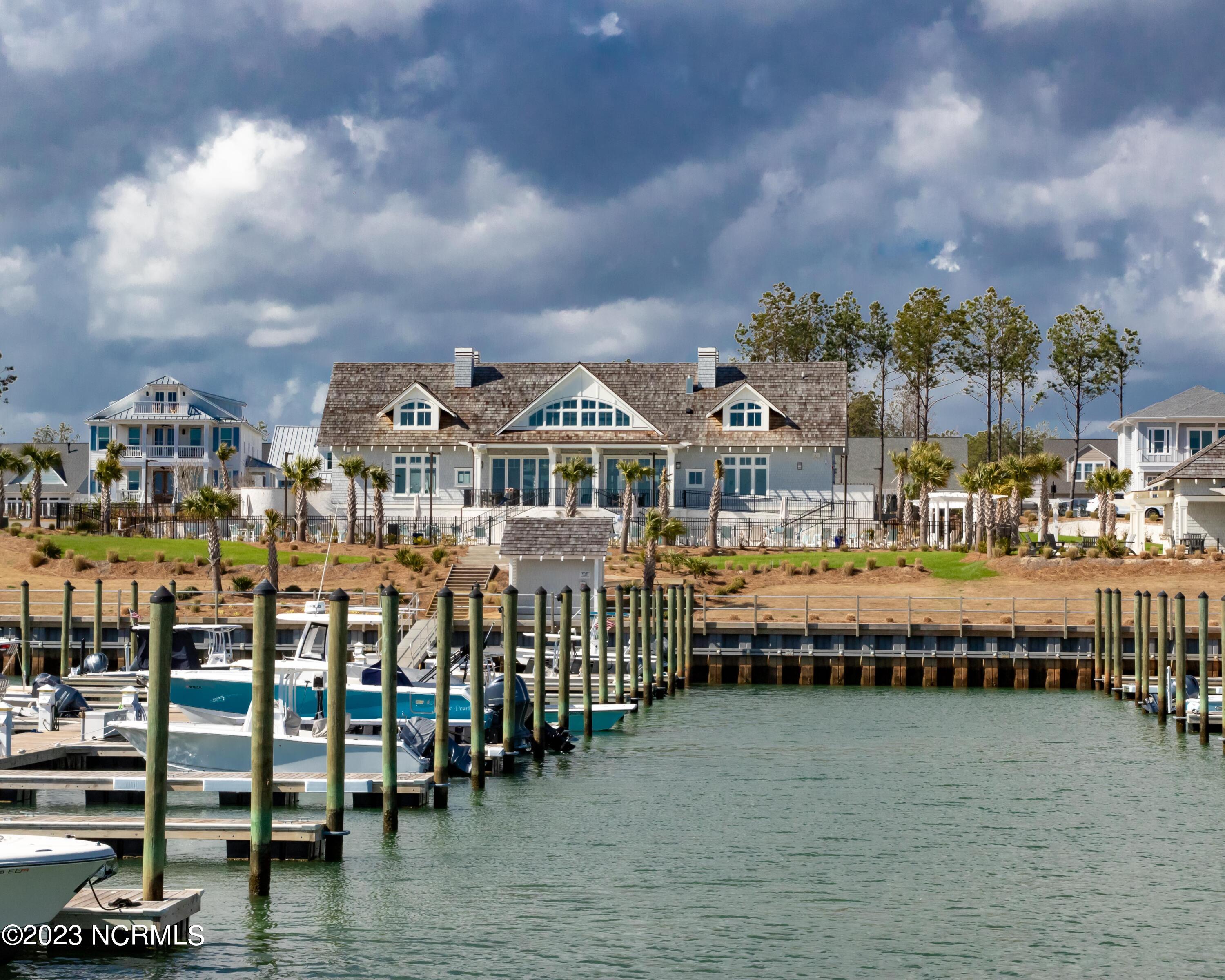 326 Jackline Drive Hampstead, NC 28443 - Photo 4 of 11 Looking at the clubhouse from the marina. 70+ private boat slips, plus a day dock.