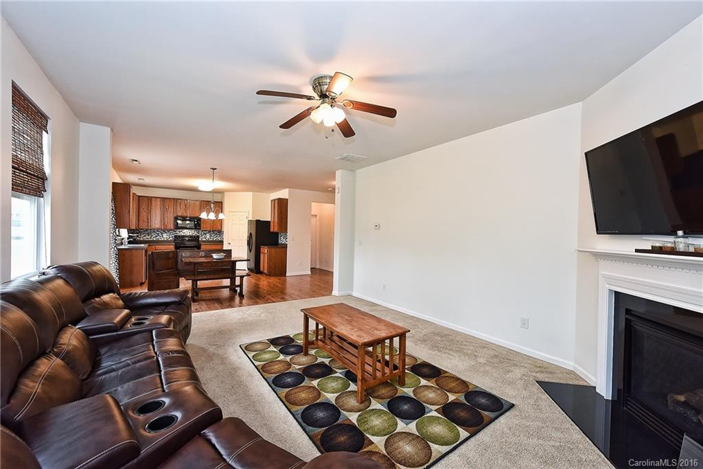1025 Skillbeck Road Indian Trail, NC 28079 - Photo 12 of 24 a living room with furniture and a flat screen tv