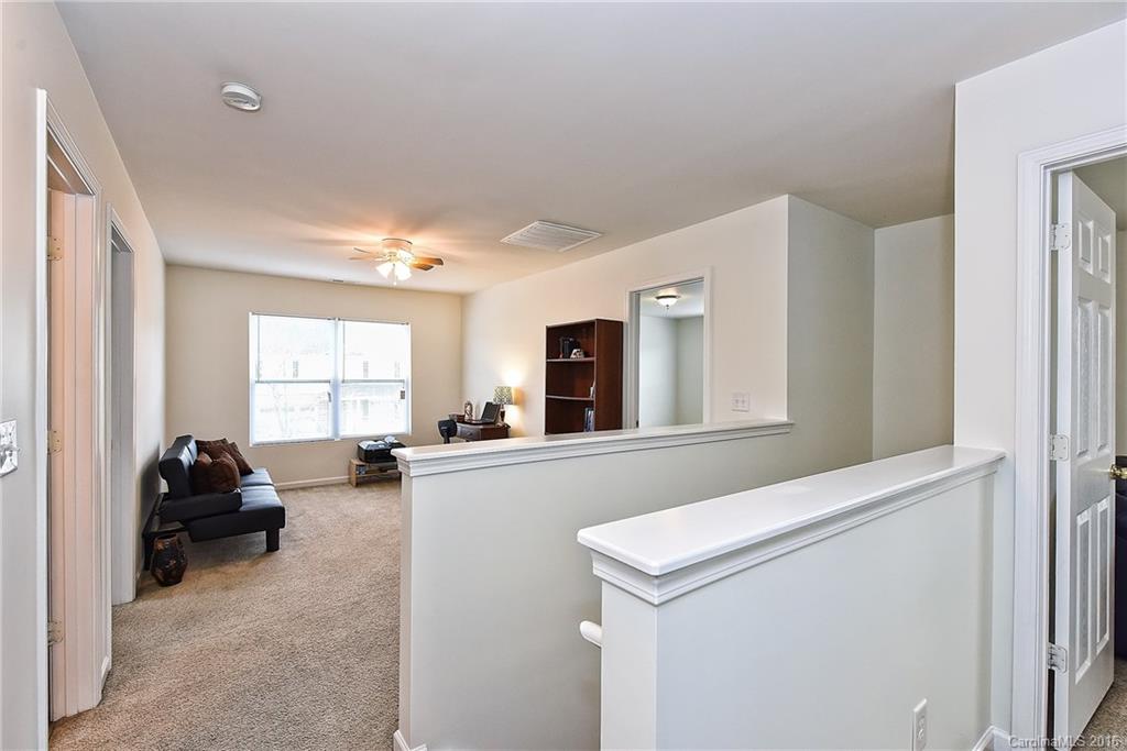 1025 Skillbeck Road Indian Trail, NC 28079 - Photo 13 of 24 a living room with furniture and a window