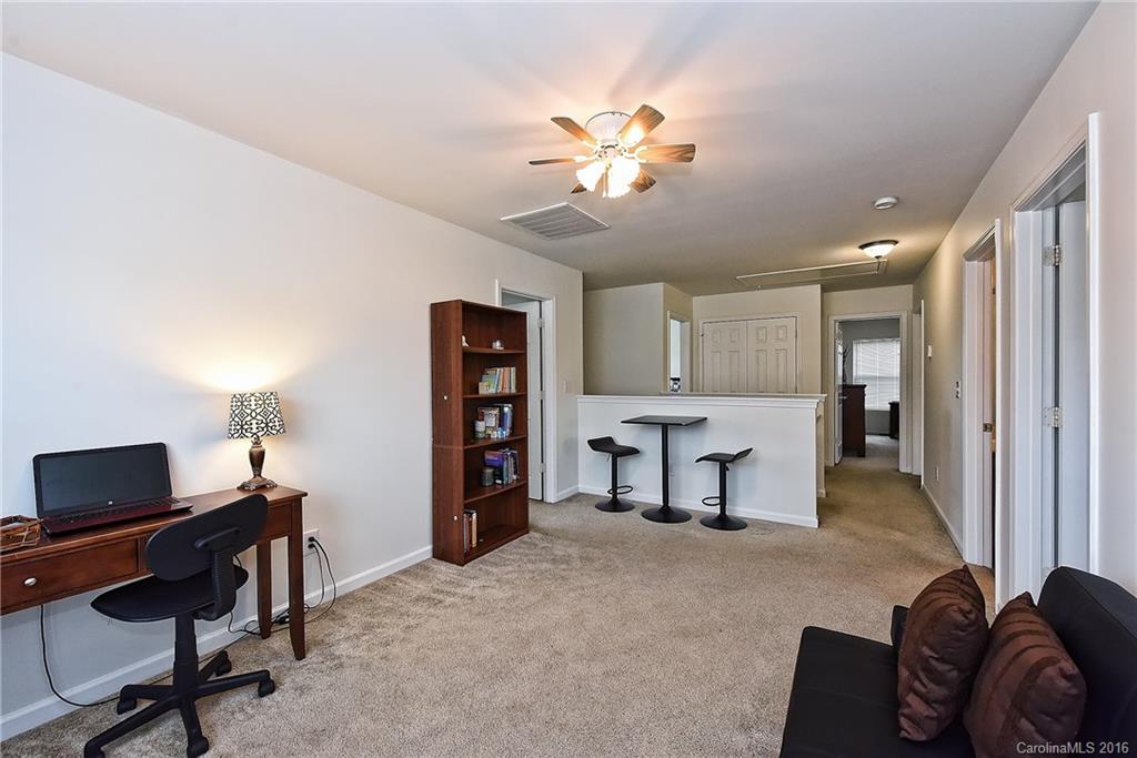 1025 Skillbeck Road Indian Trail, NC 28079 - Photo 14 of 24 a living room with furniture and a flat screen tv