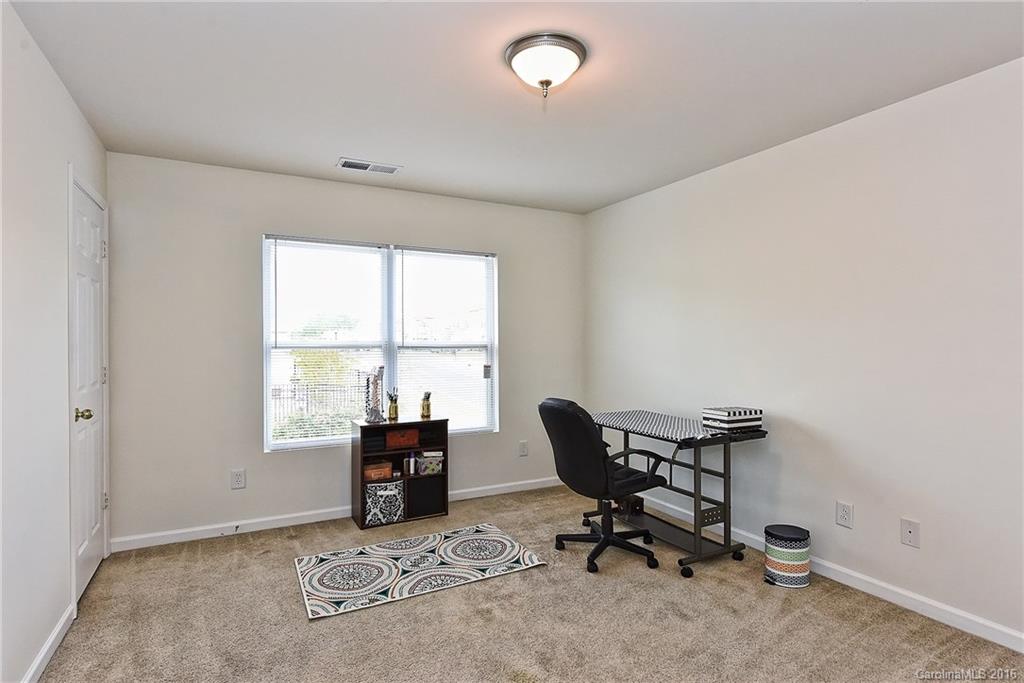 1025 Skillbeck Road Indian Trail, NC 28079 - Photo 19 of 24 a view of a workspace with furniture and a window