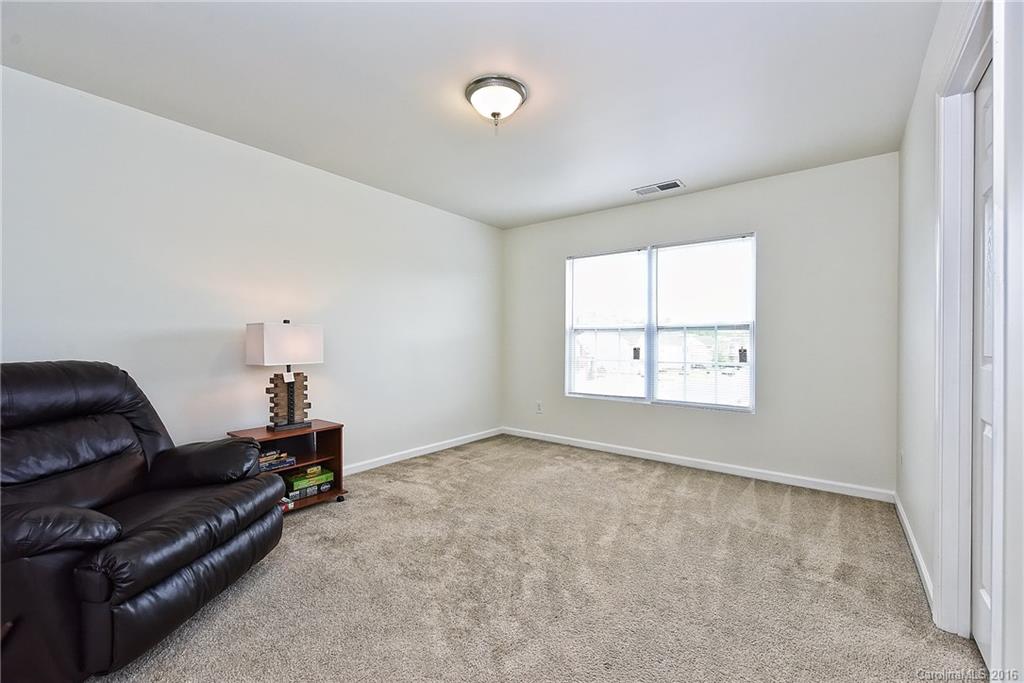 1025 Skillbeck Road Indian Trail, NC 28079 - Photo 20 of 24 a living room with furniture and a window
