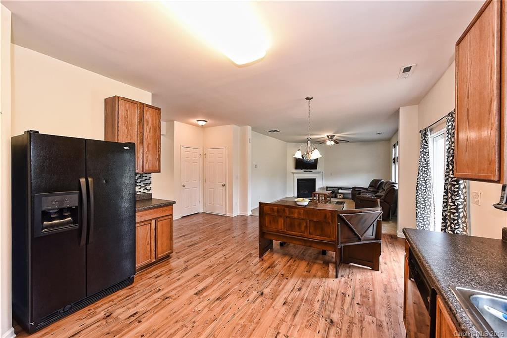 1025 Skillbeck Road Indian Trail, NC 28079 - Photo 9 of 24 a living room with furniture and a wooden floor