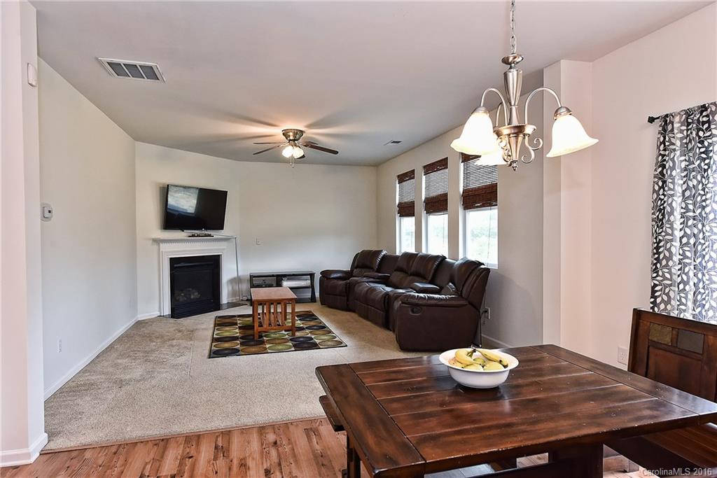 1025 Skillbeck Road Indian Trail, NC 28079 - Photo 10 of 24 a living room with furniture and a table