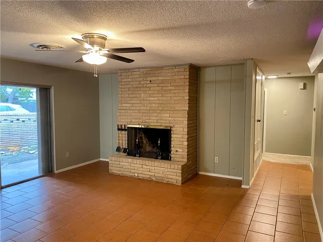 a view of a livingroom with a fireplace