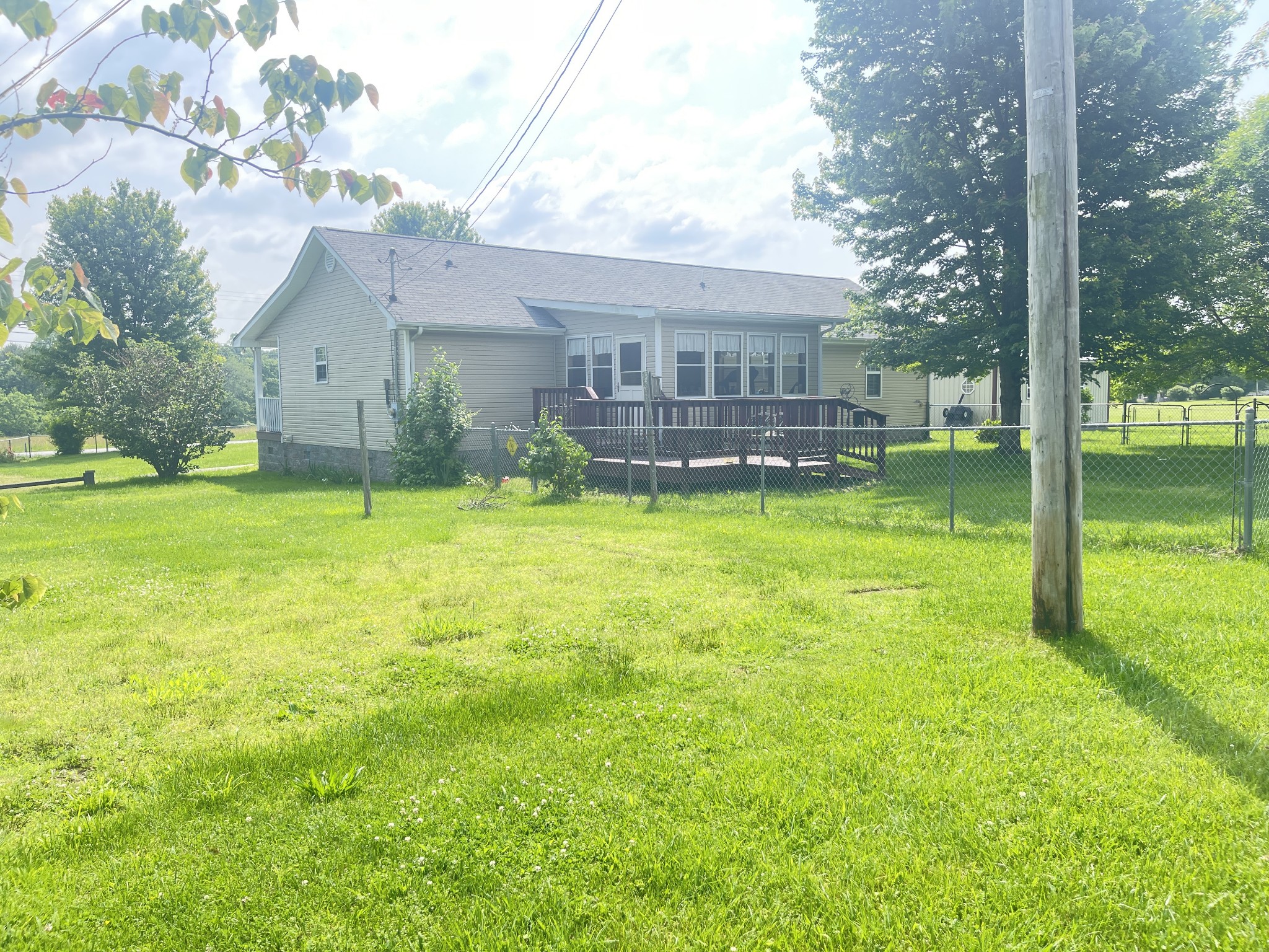 487 North Scenic Road Monteagle, TN 37356 - Photo 5 of 31 a view of a house with a big yard and a large tree