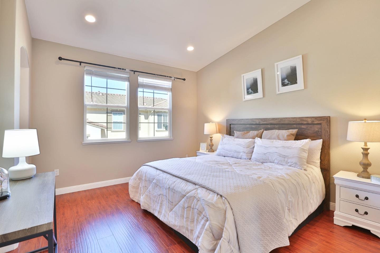 1105 Luz Del Sol Tr Loop Milpitas, CA 95035 - Photo 13 of 34 a bedroom with a bed and a lamp on dresser