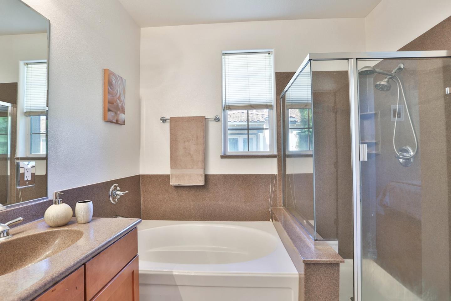 1105 Luz Del Sol Tr Loop Milpitas, CA 95035 - Photo 21 of 34 a bathroom with a tub sink and mirror