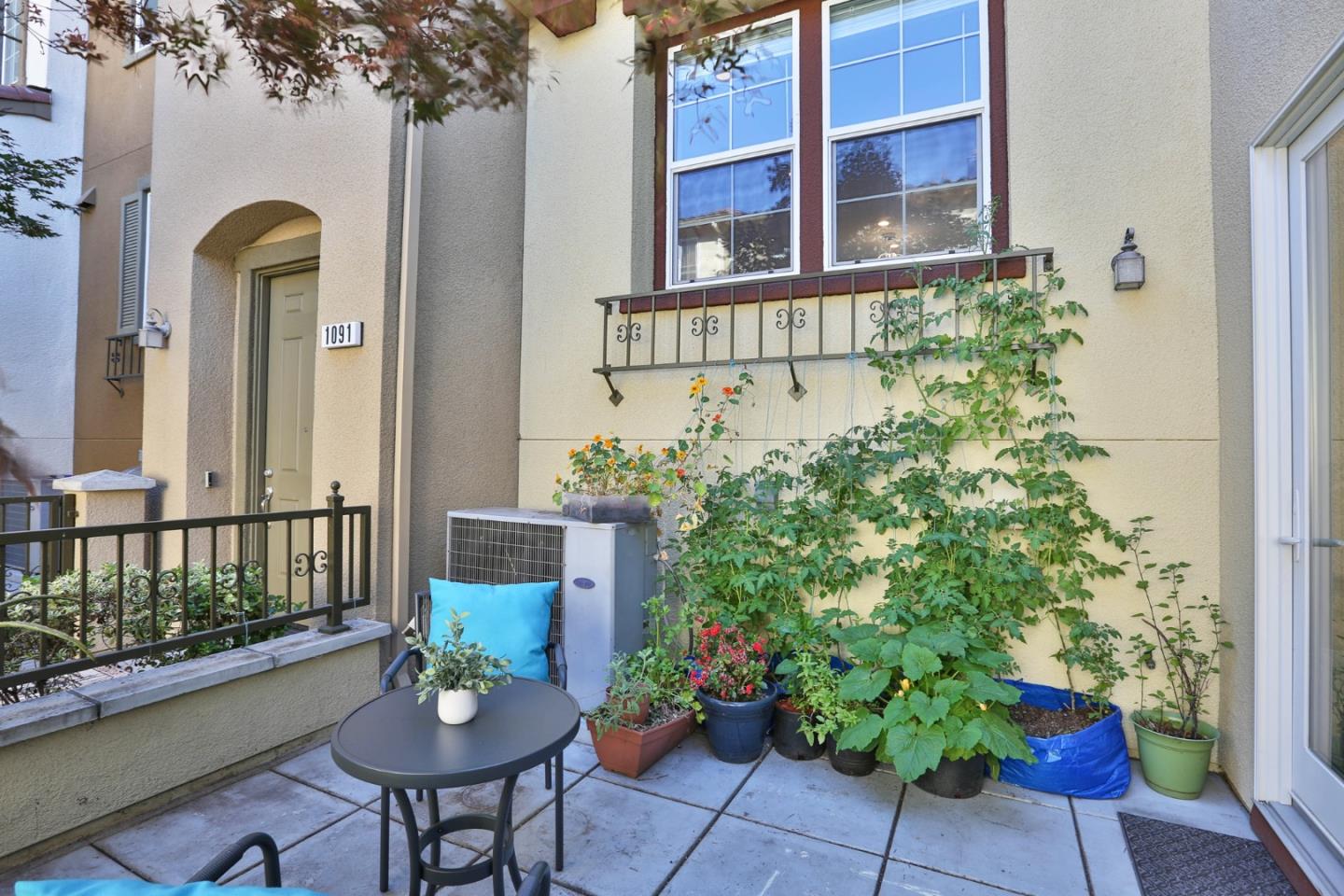 1105 Luz Del Sol Tr Loop Milpitas, CA 95035 - Photo 25 of 34 a front view of a house with a garden