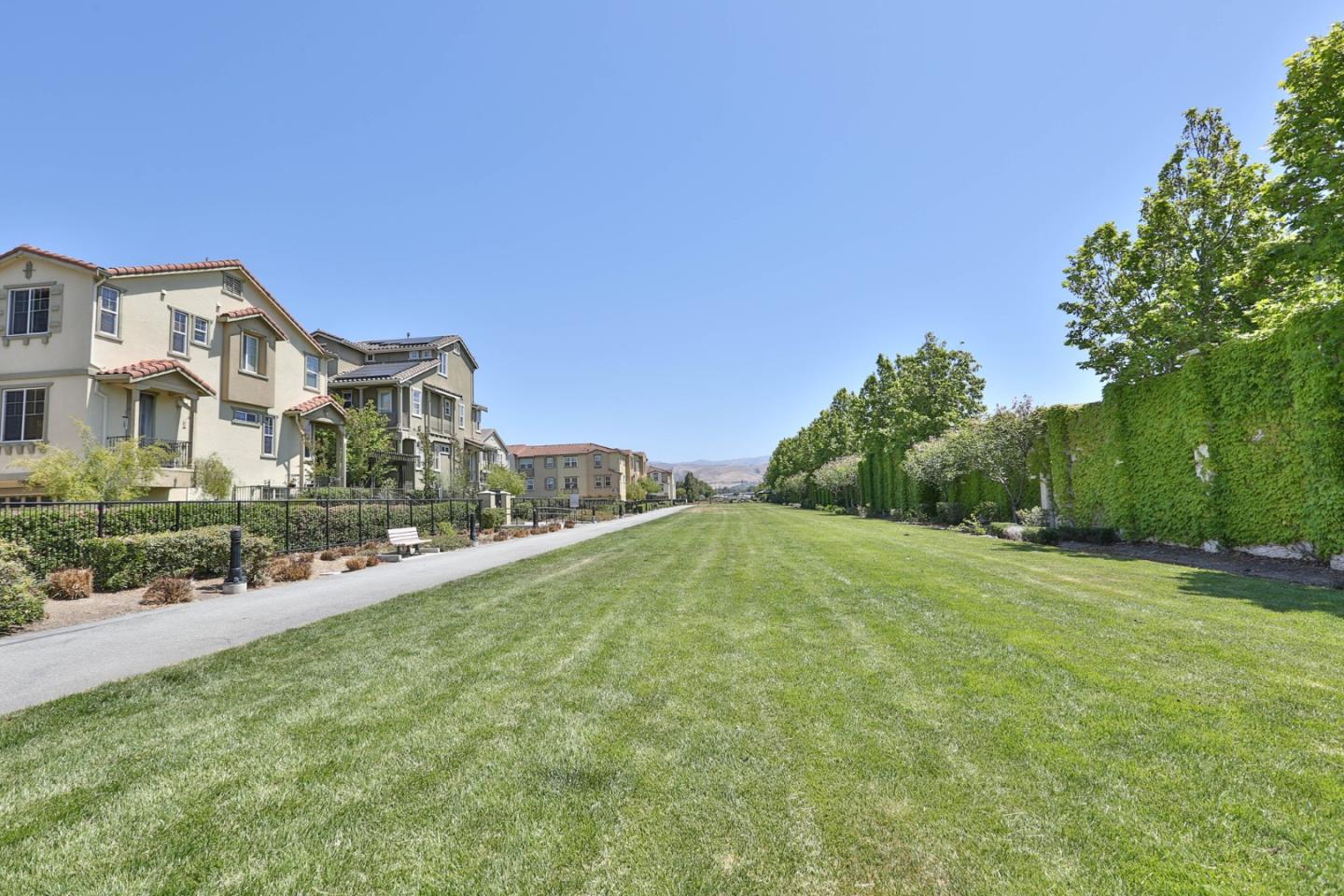 1105 Luz Del Sol Tr Loop Milpitas, CA 95035 - Photo 29 of 34 a front view of a house with a yard
