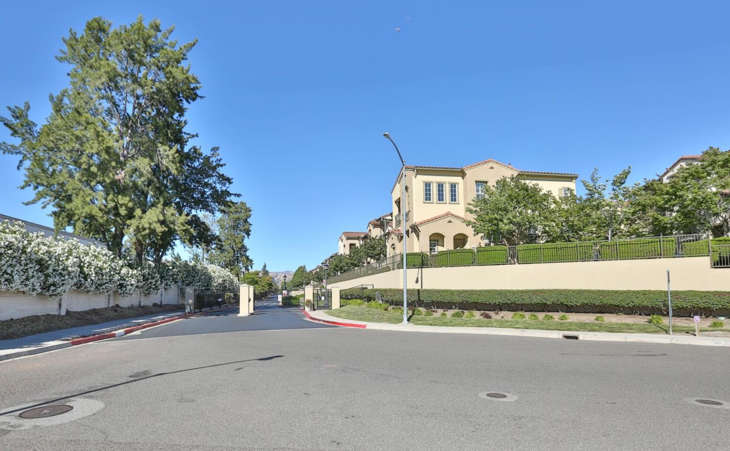 1105 Luz Del Sol Tr Loop Milpitas, CA 95035 - Photo 30 of 34 a view of a street with a building in the background