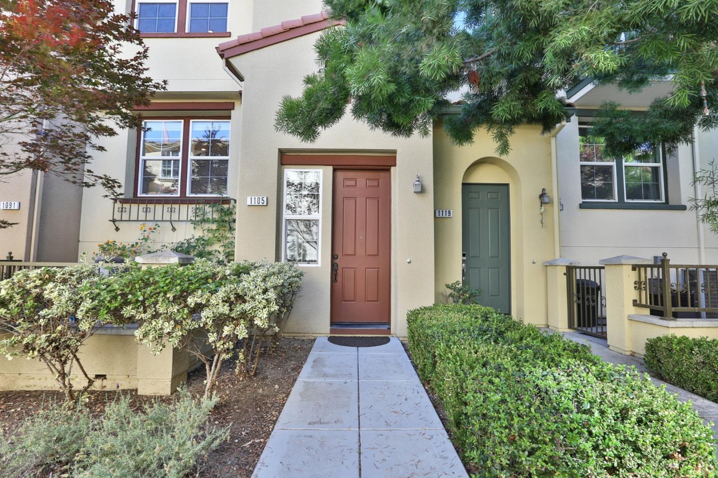 1105 Luz Del Sol Tr Loop Milpitas, CA 95035 - Photo 3 of 34 a front view of a house with a yard and potted plants