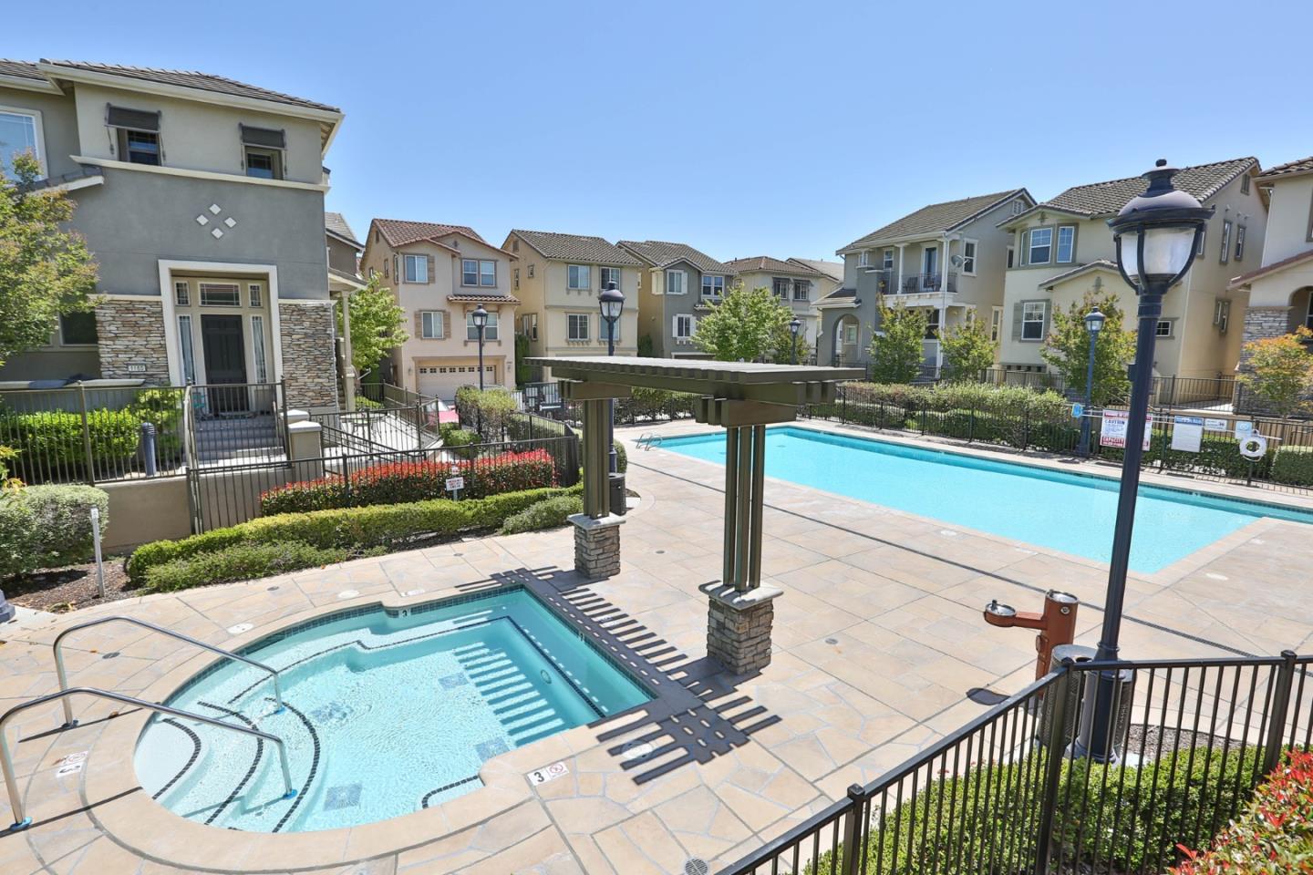 1105 Luz Del Sol Tr Loop Milpitas, CA 95035 - Photo 31 of 34 a view of a house with backyard and sitting area