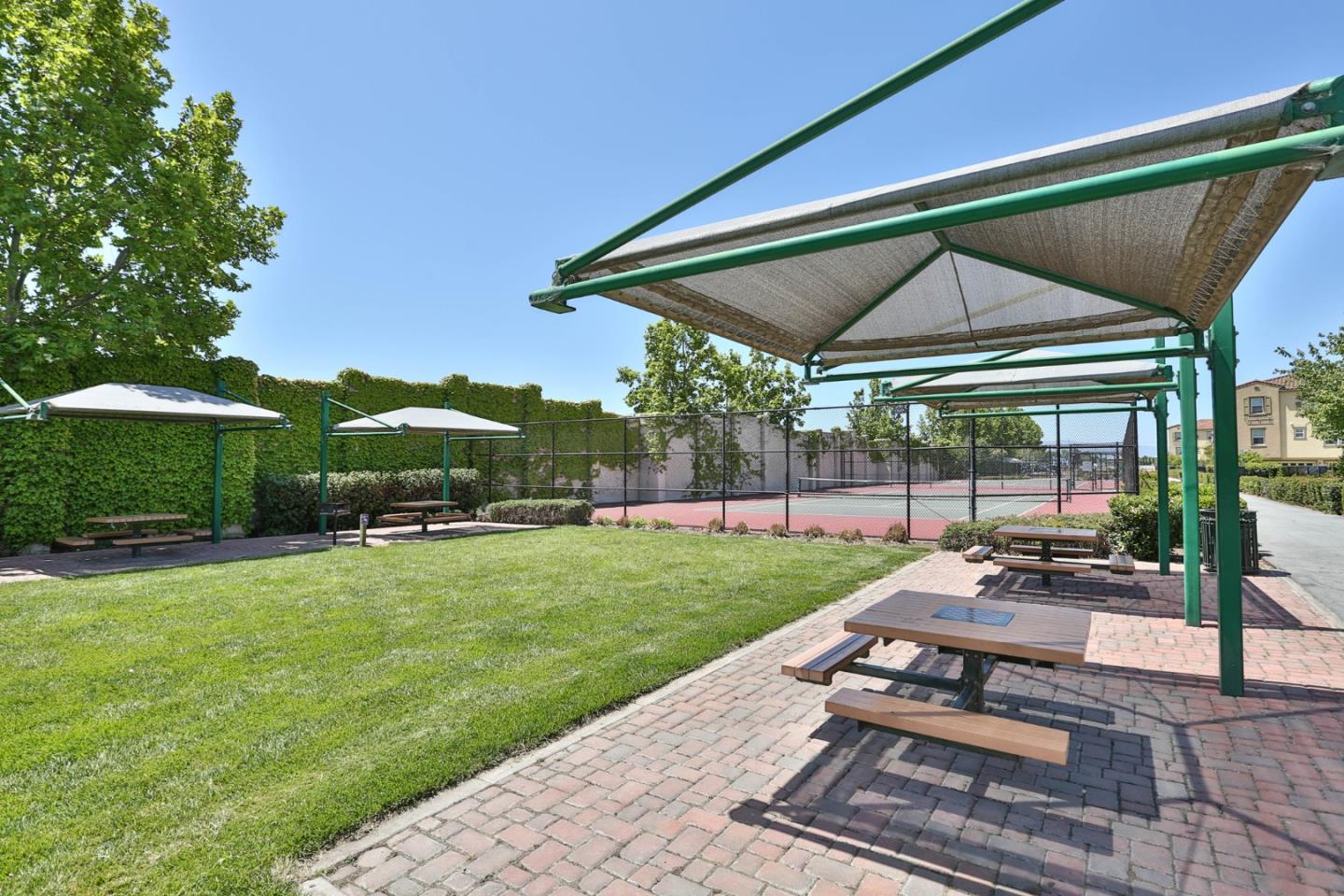 1105 Luz Del Sol Tr Loop Milpitas, CA 95035 - Photo 33 of 34 a view of a backyard with table and chairs under an umbrella