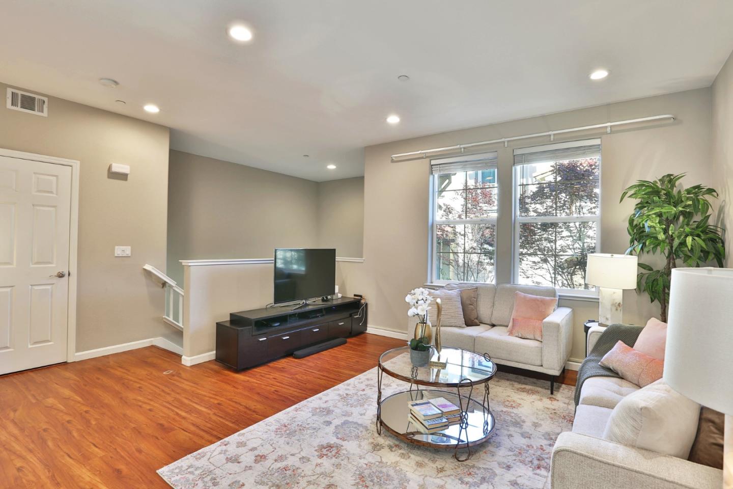 1105 Luz Del Sol Tr Loop Milpitas, CA 95035 - Photo 4 of 34 a bedroom with furniture and a large window