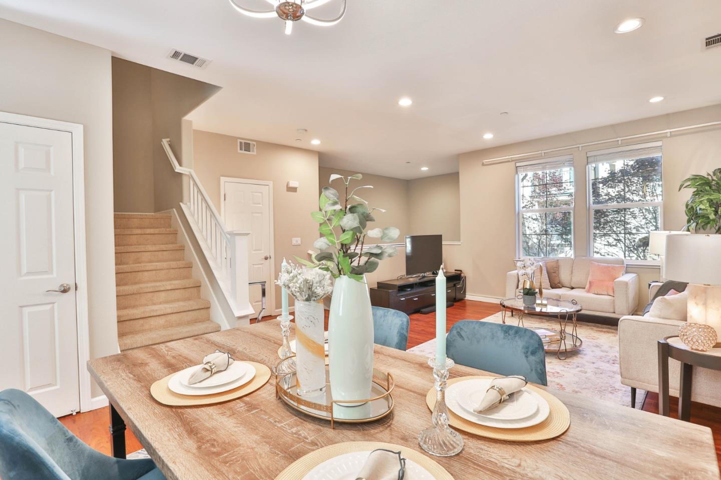 1105 Luz Del Sol Tr Loop Milpitas, CA 95035 - Photo 9 of 34 a dining room with furniture a large window and wooden floor