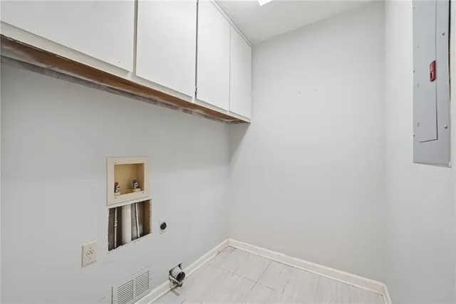 a bathroom with a sink and cabinets