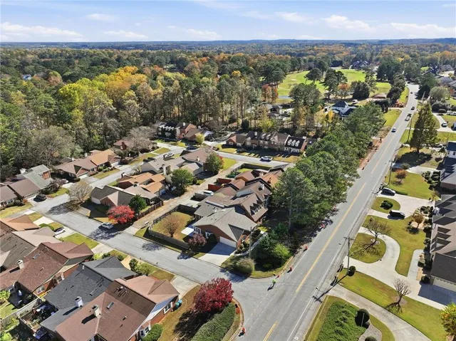 an aerial view of residential houses with outdoor space