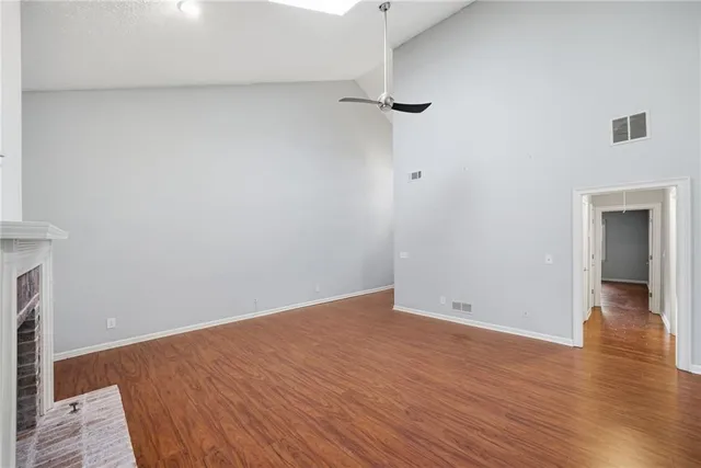 a view of room with wooden floor