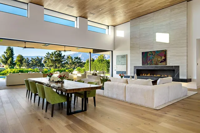 a bed room with bed and large windows