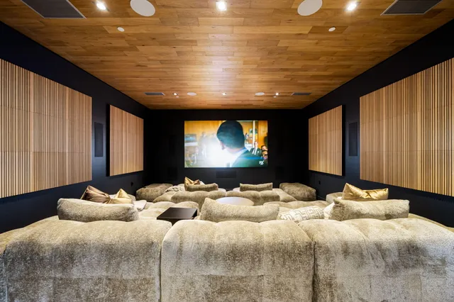 a living room with furniture pool table and a table
