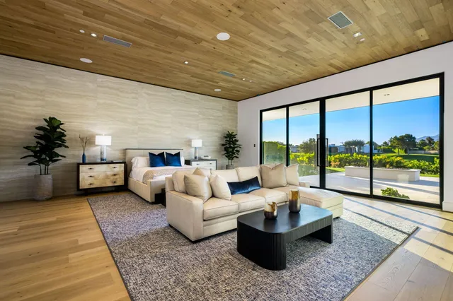 a large bathroom with a large mirror vanity sink and a shower
