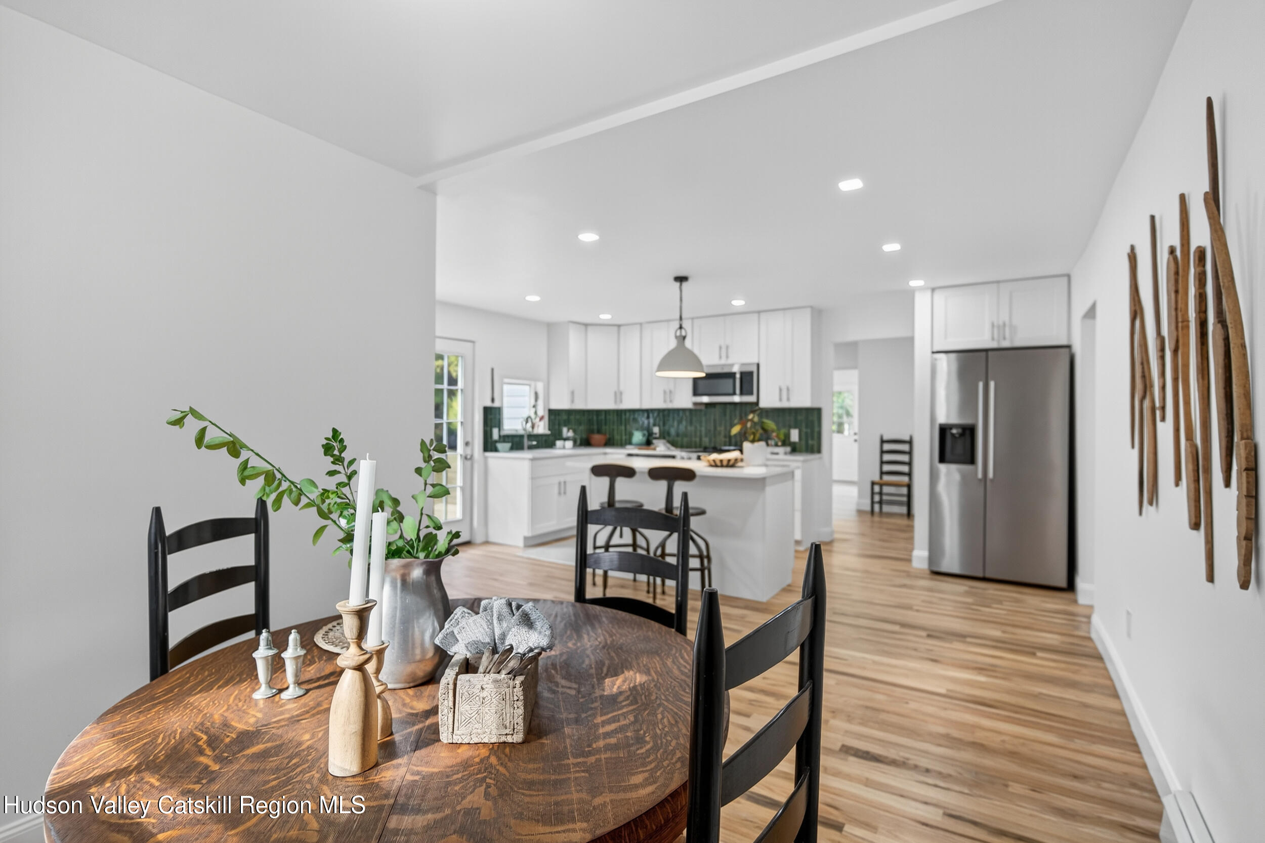 70 Fawn Road Saugerties, NY 12477 - Photo 17 of 30 a dining room with furniture wooden floor and a kitchen view