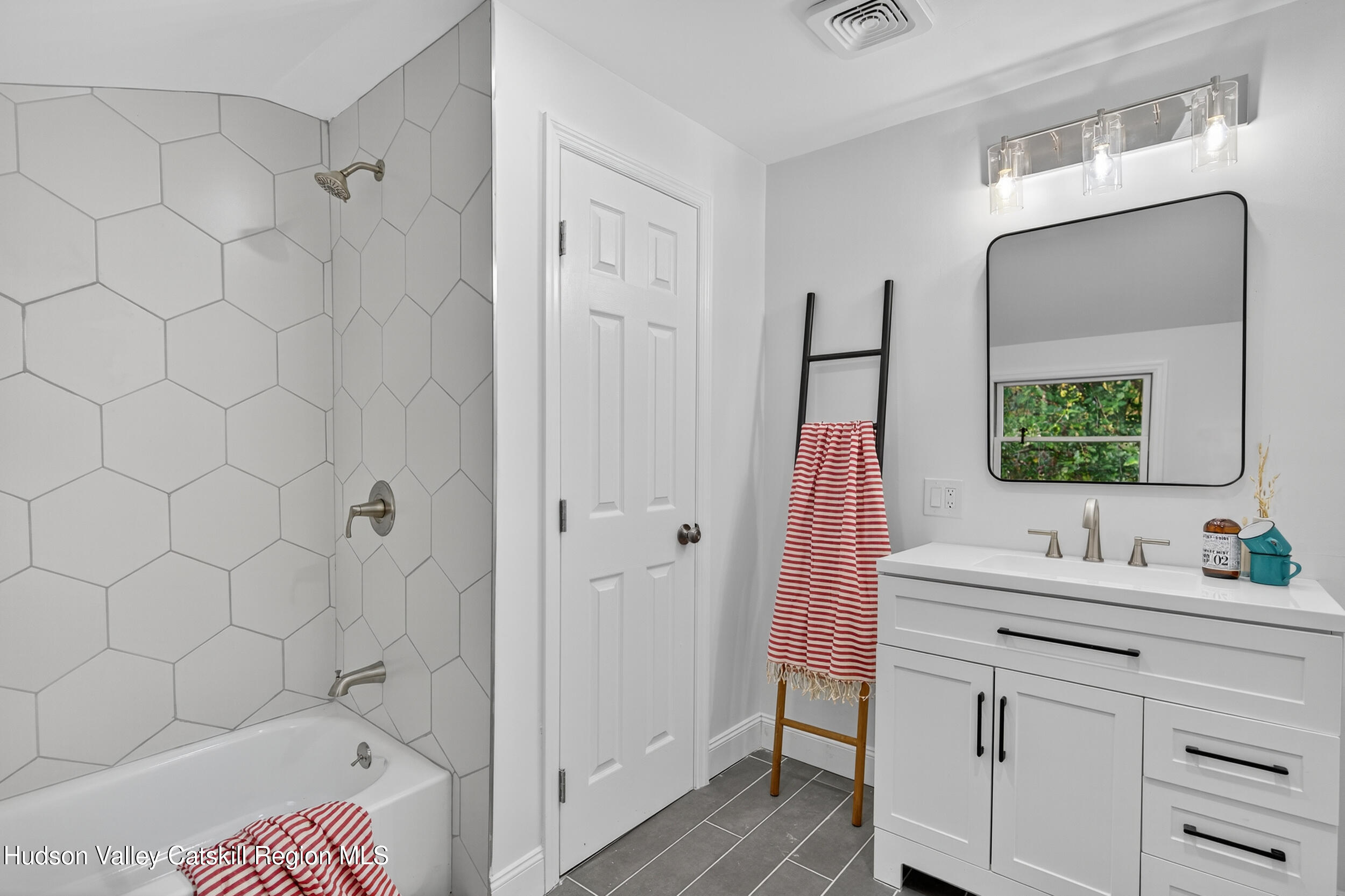 70 Fawn Road Saugerties, NY 12477 - Photo 21 of 30 a en suite bathroom with a sink and a mirror