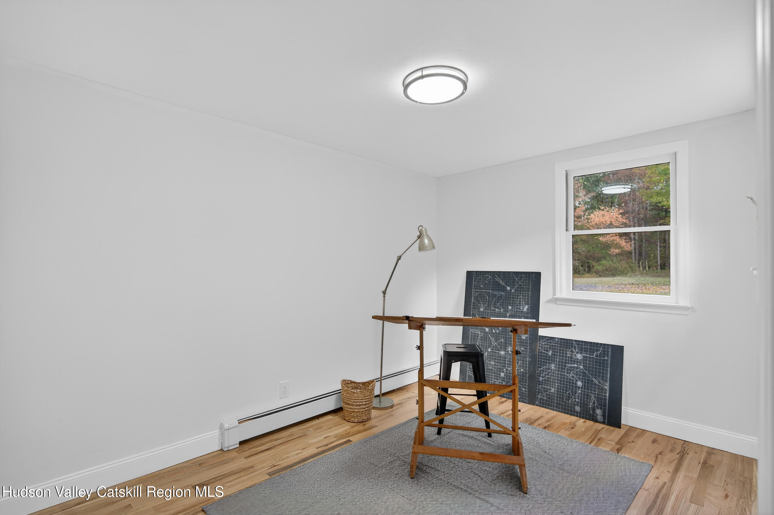 70 Fawn Road Saugerties, NY 12477 - Photo 23 of 30 a view of a workspace with furniture and a window