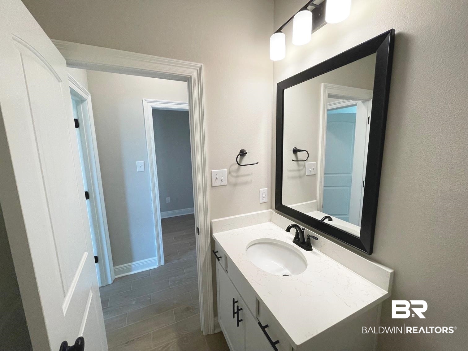 1579 Fenton Circle Foley, AL 36535 - Photo 10 of 14 Bathroom with hardwood / wood-style flooring and vanity