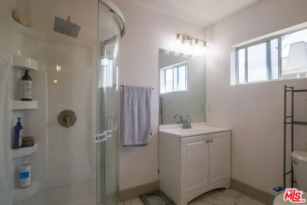 a bathroom with a sink and toilet