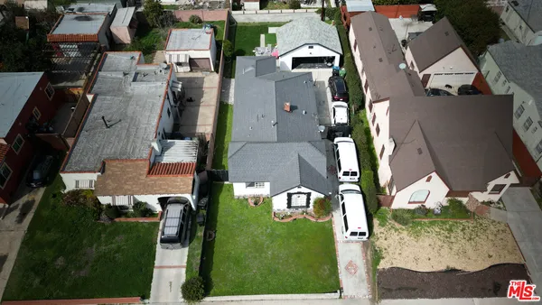 an aerial view of houses with outdoor space
