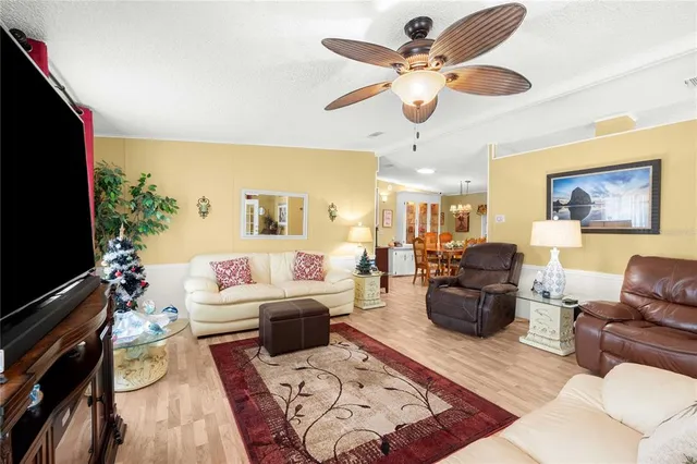 a living room with furniture flat screen tv and a fireplace