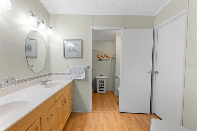 a spacious bathroom with a double vanity sink and a mirror