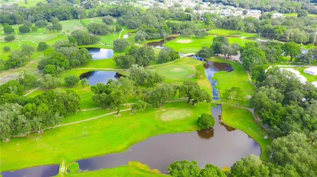 a view of a golf course with a big yard