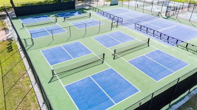 a room with pool tables and windows