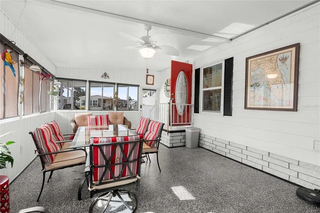 a dining room with furniture and window
