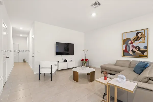 a bedroom with a bed and pillows