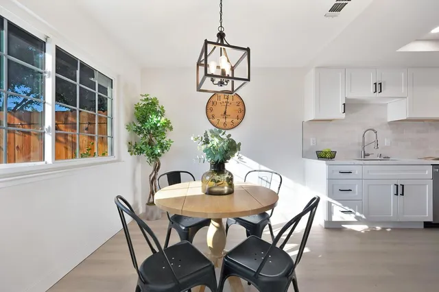 a view of a hallway with wooden floor and entryway