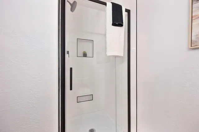a view of a livingroom with furniture and a potted plant