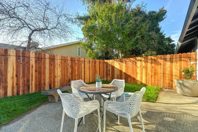 a view of a house with a yard and garage