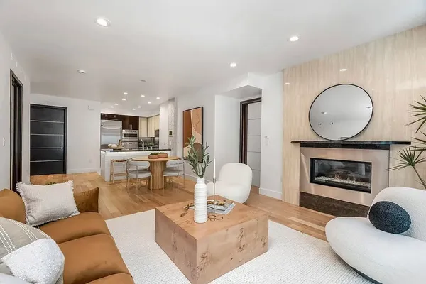 a living room with furniture and a fireplace
