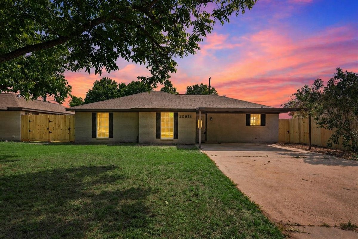 20618 Nannette Lane Spring, TX 77388 - Photo 1 of 32 a front view of a house with a yard