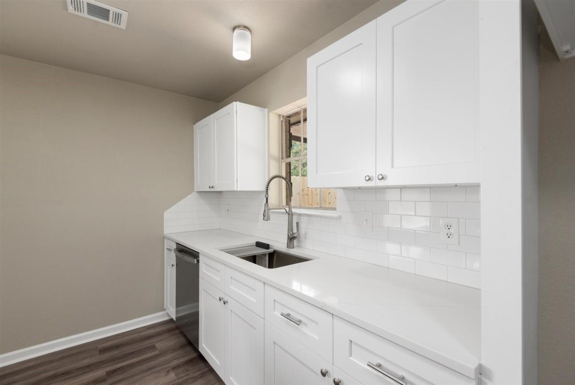 20618 Nannette Lane Spring, TX 77388 - Photo 14 of 32 a kitchen with a sink and cabinets