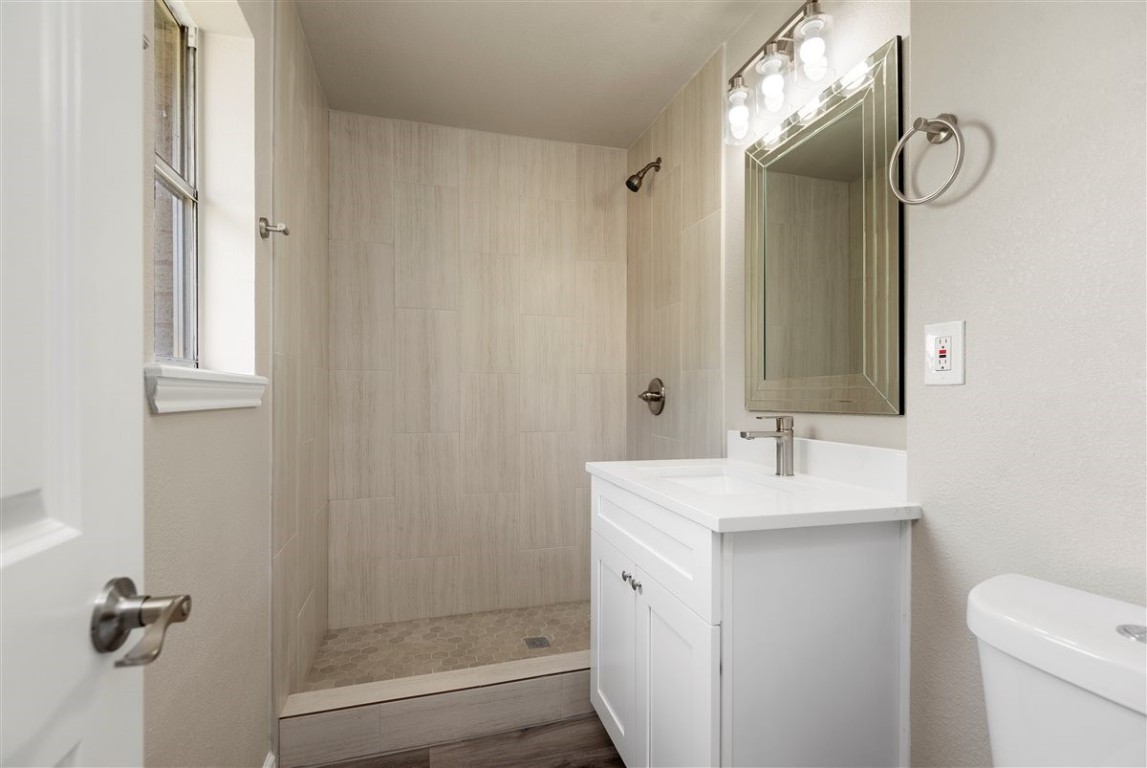 20618 Nannette Lane Spring, TX 77388 - Photo 21 of 32 a bathroom with a granite countertop sink toilet and shower