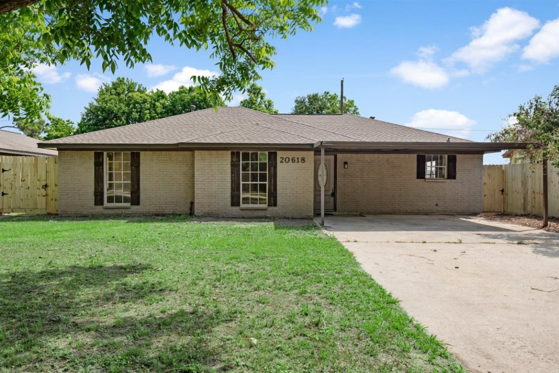 20618 Nannette Lane Spring, TX 77388 - Photo 3 of 32 front view of a house with a yard