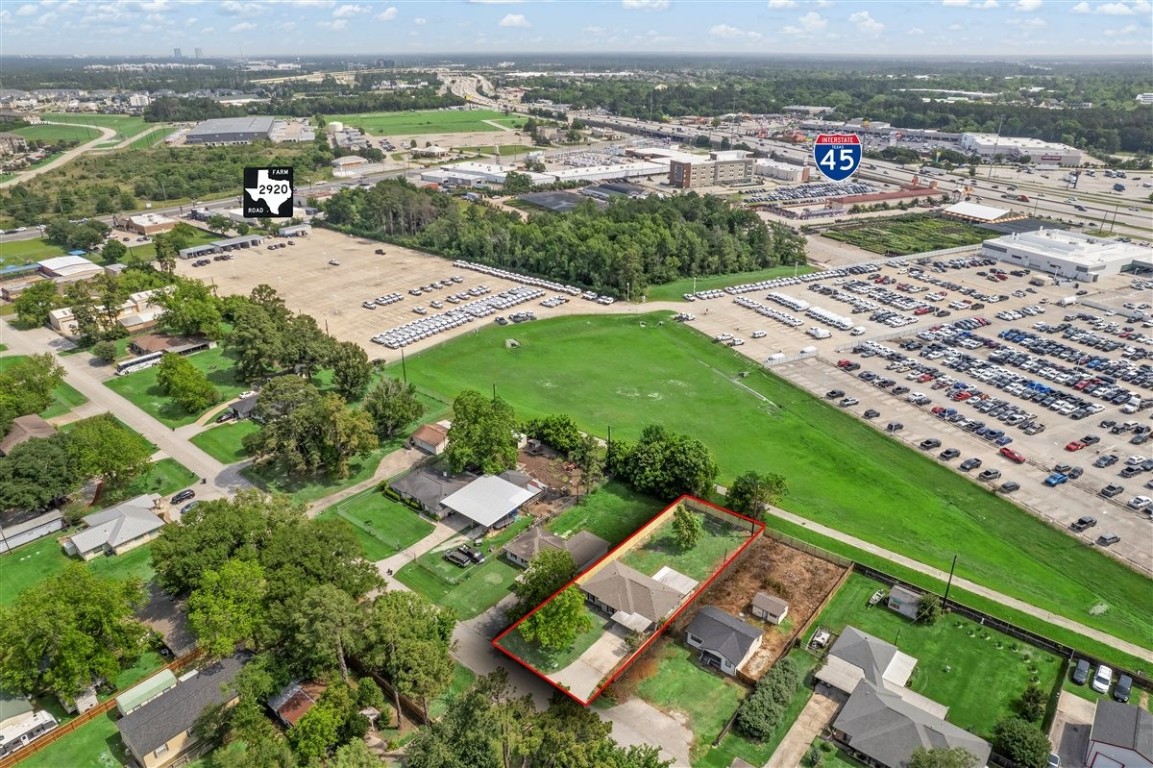 20618 Nannette Lane Spring, TX 77388 - Photo 31 of 32 an aerial view of a city with lots of residential buildings ocean and mountain view